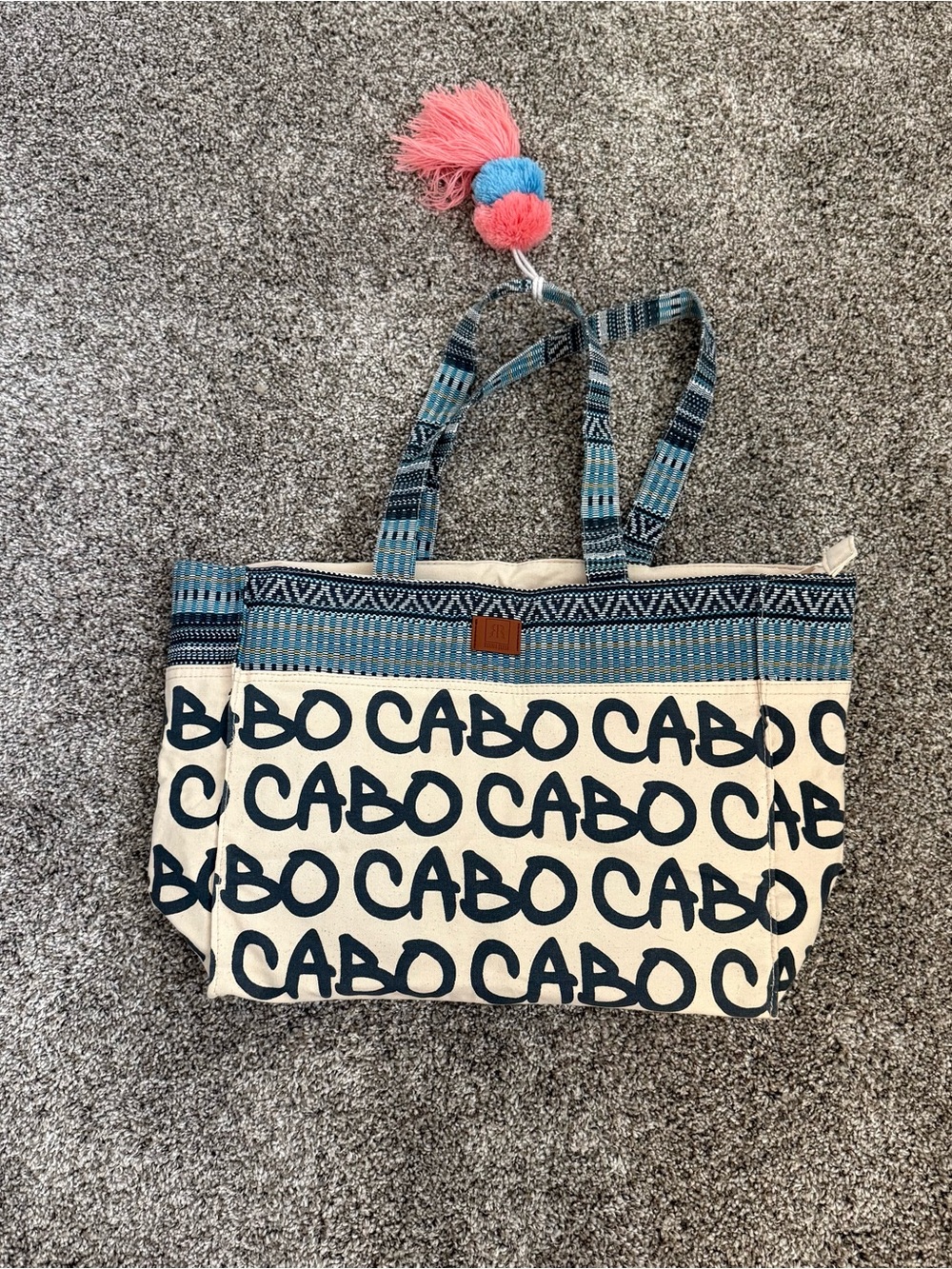 Cabo Canvas Tote Bag in Navy & Cream with Pom Accent